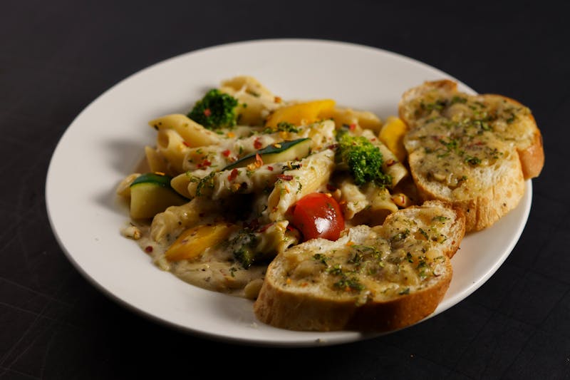 Garlic cheese bread with melted mozzarella and herbs